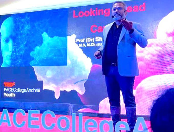 (Prof.) Dr. Shishir Shetty speaking on stage at TEDxYouth@PACE College, Andheri